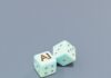 “일상 속 AI 건강 관리, 똑똑하게 챙기는 새로운 습관” Two dice with ai letters and dots